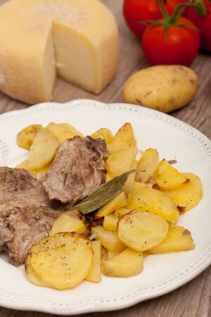 Plate of good lamb with potatoes on a white plateの写真素材