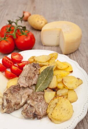 Plate of good lamb with potatoes on a white plateの写真素材