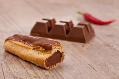 Sweet chocolate pastry on wooden background