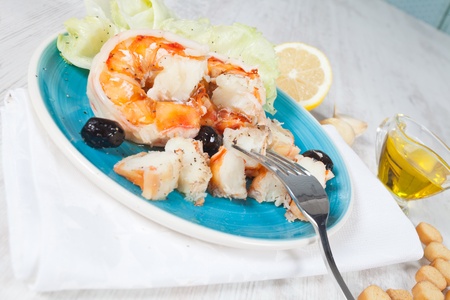 Delicious prawn salad served on a blue plateの写真素材