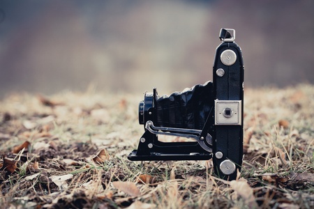 Beautiful old folding camera in a vintage stile