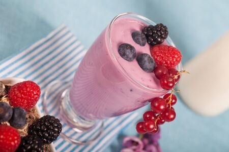 Glass of fresh delicious yogurt with berry fruitsの写真素材