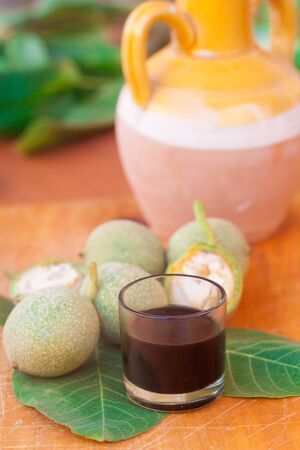 small glass of home made Liqueur of walnuts の写真素材