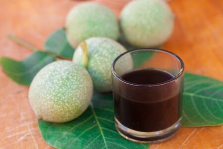 small glass of home made Liqueur of walnuts 