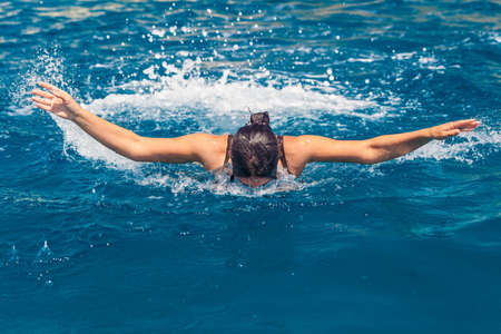 Swimming in a deep blue open water in south of italy