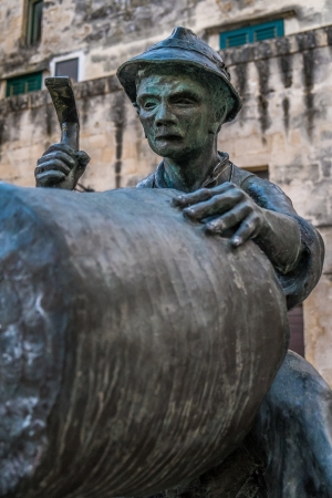 Bronze statue of an old artisan in Materaの写真素材