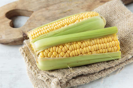 Fresh raw corncob on jute cloth