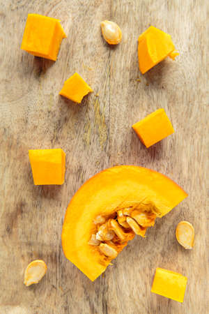 Fresh chopped raw red kuri squash in autumn seasonの写真素材