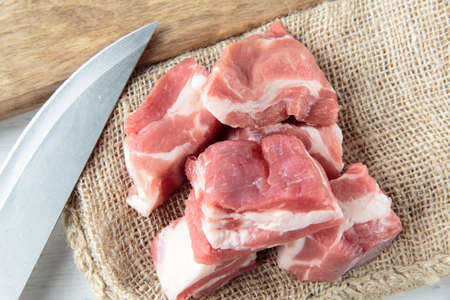 Fresh raw pork chops on a jute clothの写真素材
