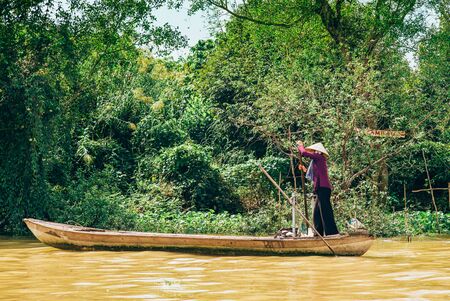 Rolling boats sailing along the Mekong river in Vietnamの写真素材