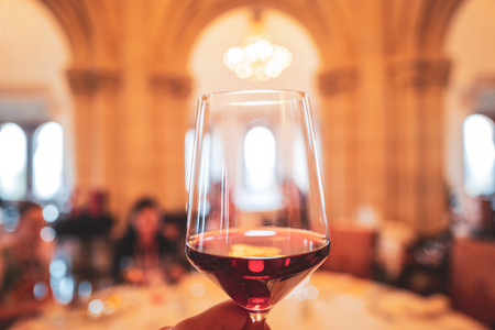 Cheering with a glass of wineの写真素材