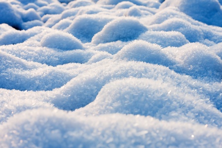 The blue sky reflecting back to snow crystalsの写真素材