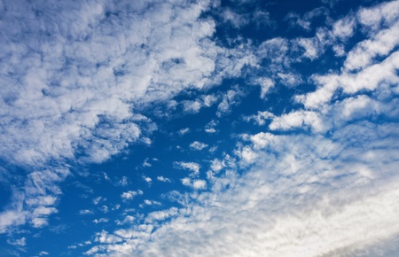 White cumulus clouds and a blue sky.の写真素材