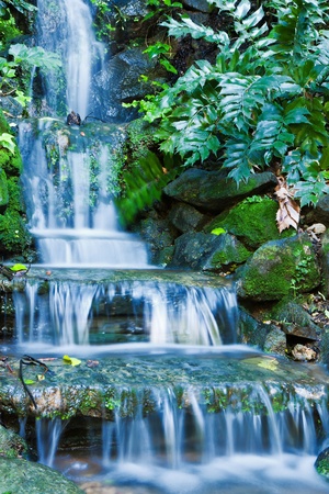 Beautiful veil cascading waterfalls, mossy rocks の写真素材