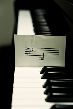 Piano with a simple noteの写真素材