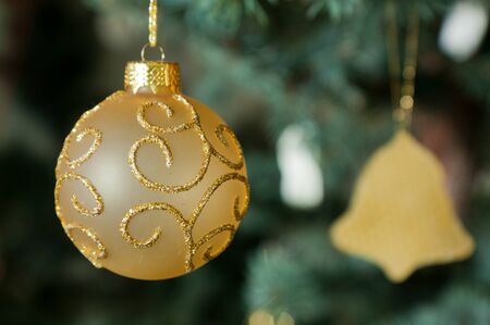 Christmas ornament hanging from the pineの写真素材