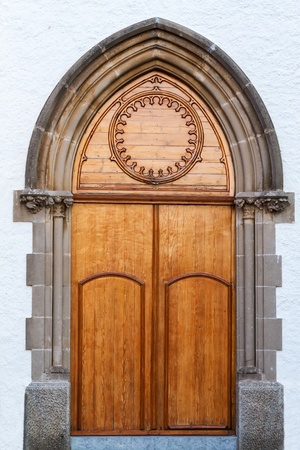 Beautiful old church door in Barcelona の写真素材