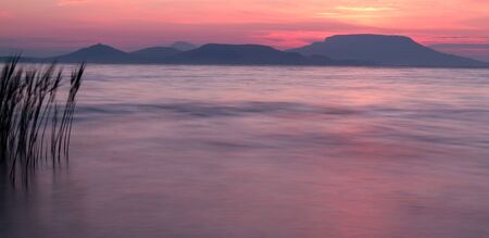 Beautiful sunrise over the lakeの写真素材