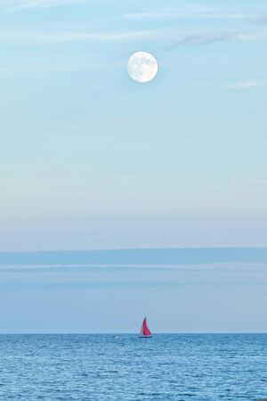 Full moon over oceanの写真素材