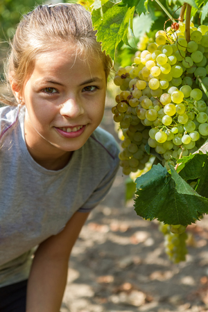 Pretty girl portrait with grapesの写真素材