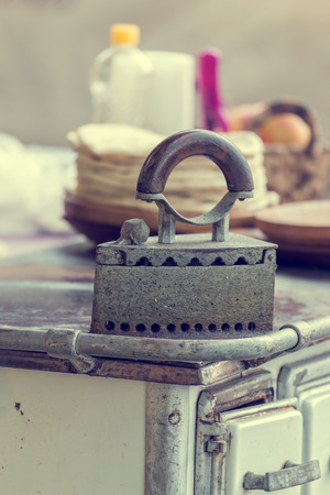 Old antique vintage brass coal iron flatironの写真素材