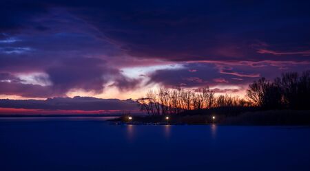 Beautiful sunset light on winter lake Balaton (Hungary)の写真素材
