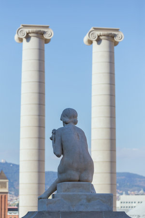 Female statue from the back and The Four Columns ("Les Quatre Columnes" in Catalan), Montjuic Barcelona, Catalunya/Spain ,01 november 2016のeditorial素材