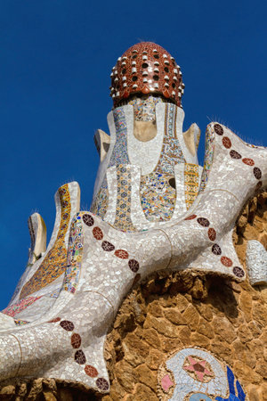 Detail of colorful mosaic work of Park Guell. In 1984 UNESCO declared the park a World Heritage Site...