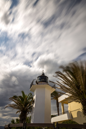 Lighting tower in Costa Brava, village Palamos (Spain) with long exposureの写真素材