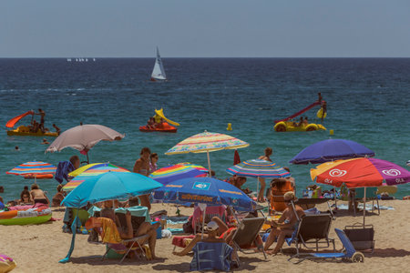 Beach life in a small spanish town Palamos (Spain,Costa Brava), July 27, 2017, Spainのeditorial素材
