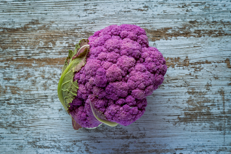 Purple color cauliflower vegetable on a gray tableの写真素材