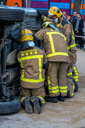 Firemanâs exhibition on village Palamos. Imitated car accident, with one injured person. March 10, 2018 , Spainのeditorial素材