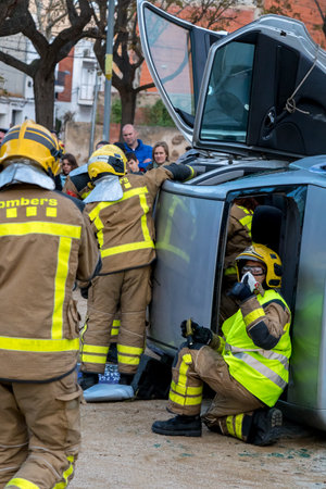 Firemanâs exhibition on village Palamos. Imitated car accident, with one injured person. March 10, 2018 , Spainのeditorial素材