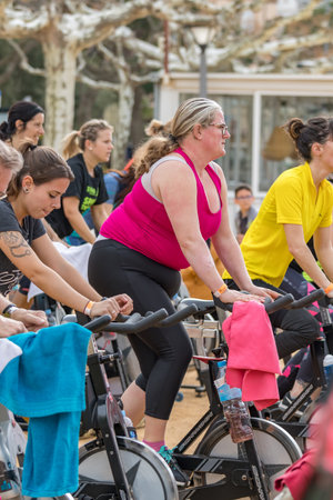 Sports and health day outdoors in Costa Brava in town Palamos. Spinning class. 07. 04. 2018 town...