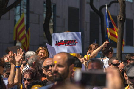 Catalan demonstrators with national catalan symbols in Barcelona to support the freedom of the political prisoners.More than 300.000 people have participated in the demonstration. 04. 16. 2018 Spain, Barcelonaのeditorial素材