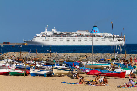 Big tourist ship near the mediterranean town Palamos in Spain, Tui ship, 08. 03. 2012 Spainのeditorial素材