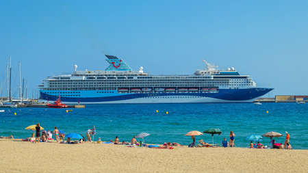 Big ship, names Marella Explorer, on a harbor a small Spanish village in Costa Brava. 06. 07. 2018 Spainのeditorial素材