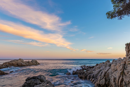 Beautiful blue ocean picture with interesting clouds in a Spanish coastal, in Costa Brava, near the town Palamosの写真素材