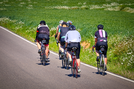Group of cyclist on the road at springtimeの写真素材