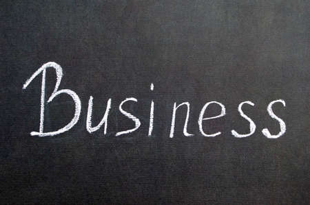 Chalk business word text on black background. Success strategy concept business word on chalkboardの写真素材