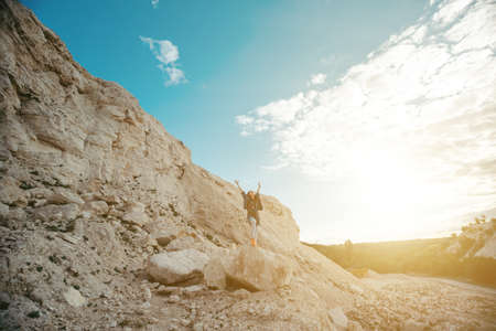 Young woman dressed colorful clothes posing and dancingの写真素材