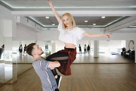 Young modern dancers dancing in the studio. Sport, dancing and urban culture conceptの写真素材