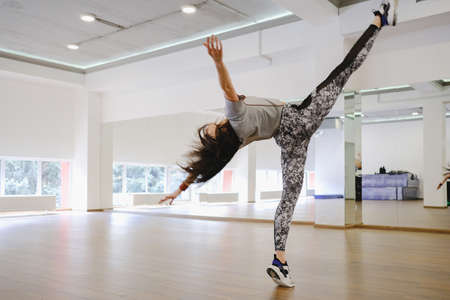 Young modern dancer dancing in the studio. Sport, dancing and urban culture conceptの写真素材