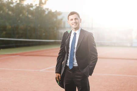 Portrait of successful businessman holding one hand in his pocket, outdoors. Concept of leadership...