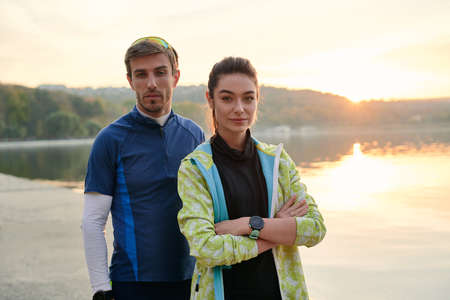 Young couple on outdoor morning workout. Sport motivation and healthy fitness lifestyle.の写真素材