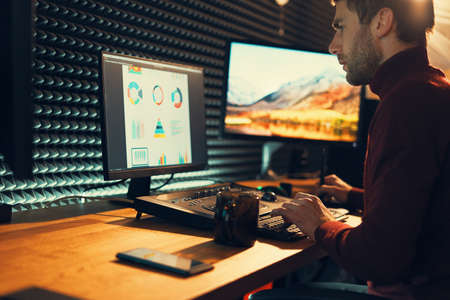 Confident Man Video Editor Works with Footage in Creative Office Studio.