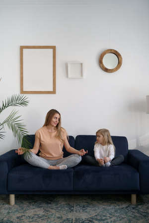 Togetherness Concept. Daughter hugging her mum. Love family, parenthood childhood concept. Mom and her kid playing togetherの写真素材