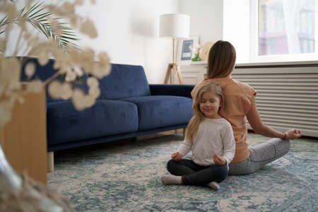 Togetherness Concept. Daughter hugging her mum. Love family, parenthood childhood concept. Mom and her kid playing togetherの写真素材