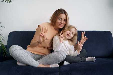 Togetherness Concept. Daughter hugging her mum. Love family, parenthood childhood concept. Mom and...