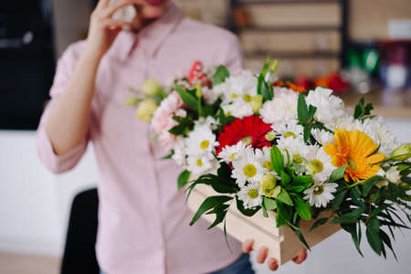 Online flower delivery. online store of flowers and bouquets. The flower business. Selling fresh flowering compositionsの写真素材